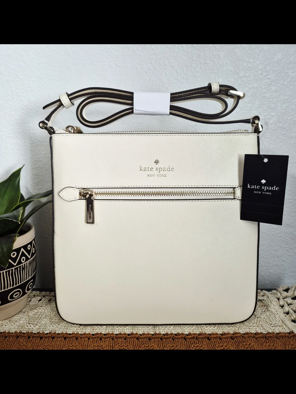 Kate Spade Sadie Cream Saffiano Leather crossbody with front zip